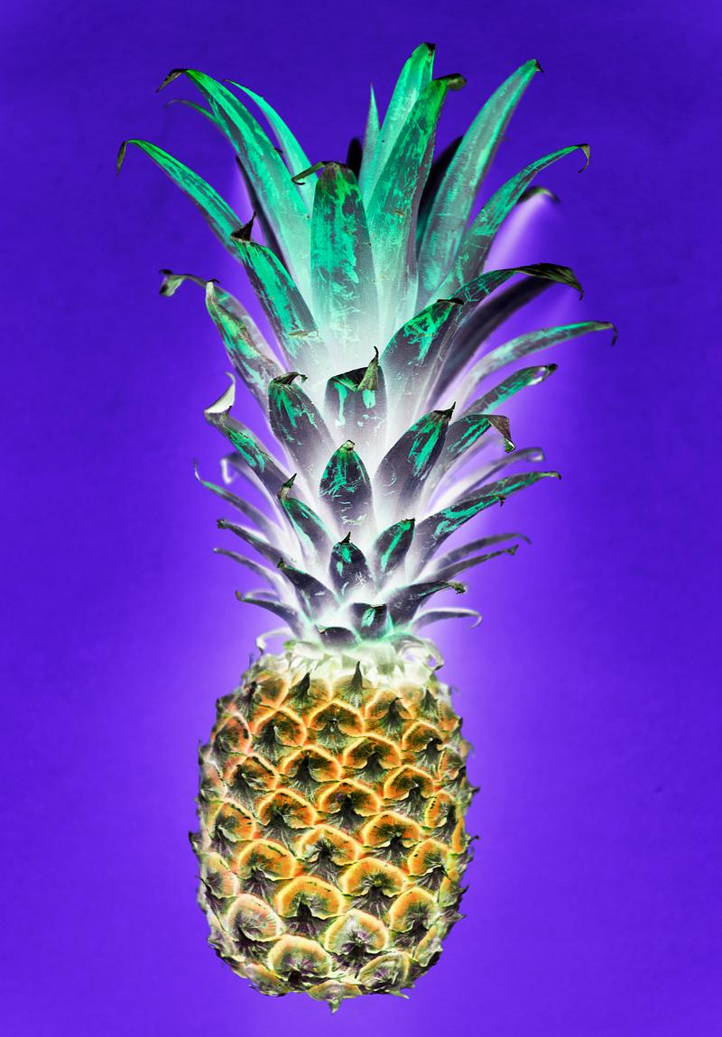 Aerial view of pineapple in negative filter blue background Aerial view of pineapple in negative filter blue background