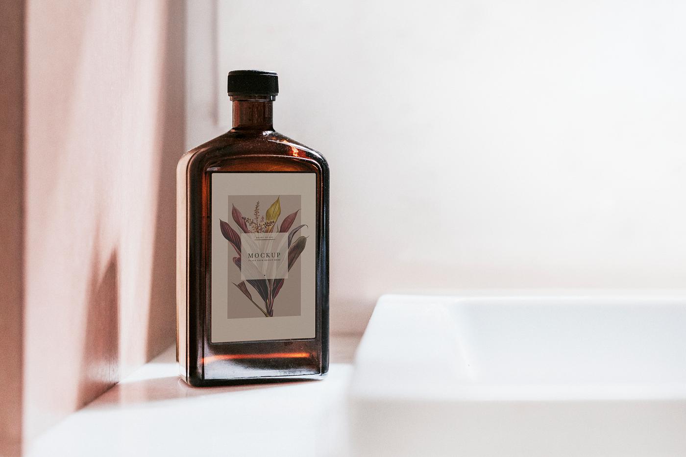 Liquid brown bottle mockup by a basin Liquid brown bottle mockup by a basin