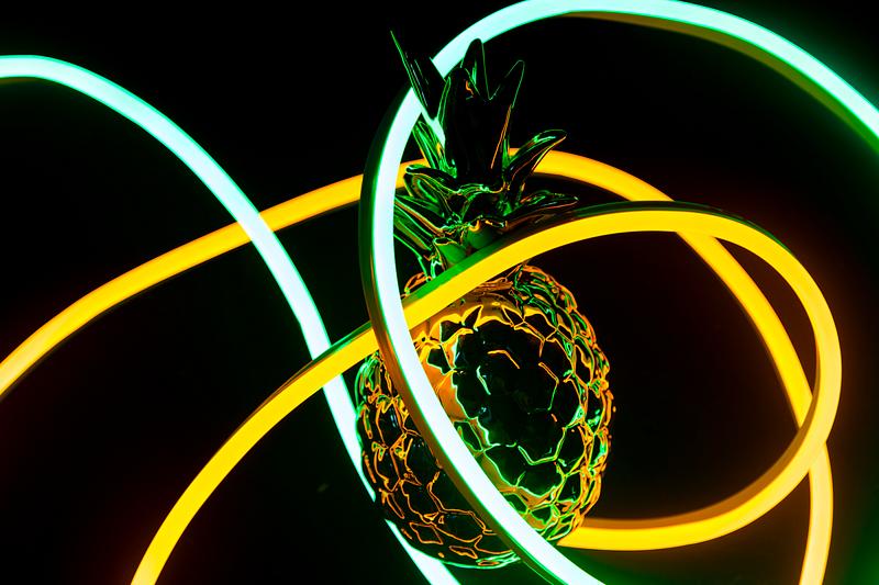 Pineapple covered in neon lights Pineapple covered in neon lights