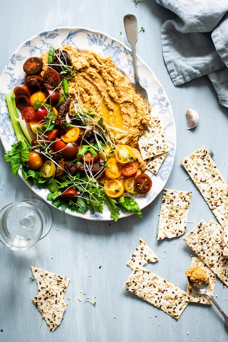 Delicious homemade hummus in a bowl with pita bread