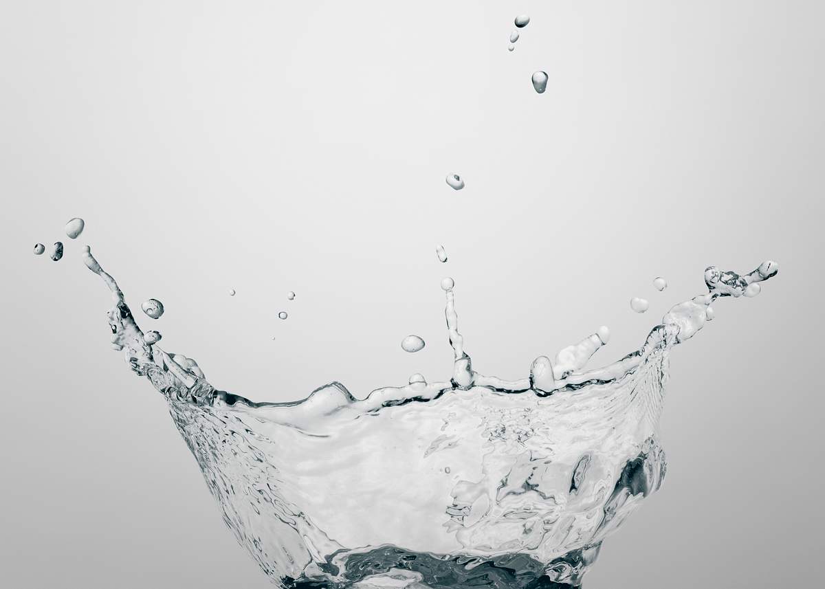 Download Macro Shot Of Water Splash With Reflection