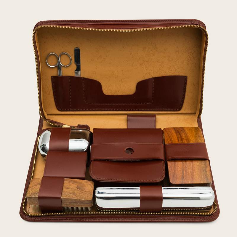 Download Travel kit in a brown leather bag mockup design resource