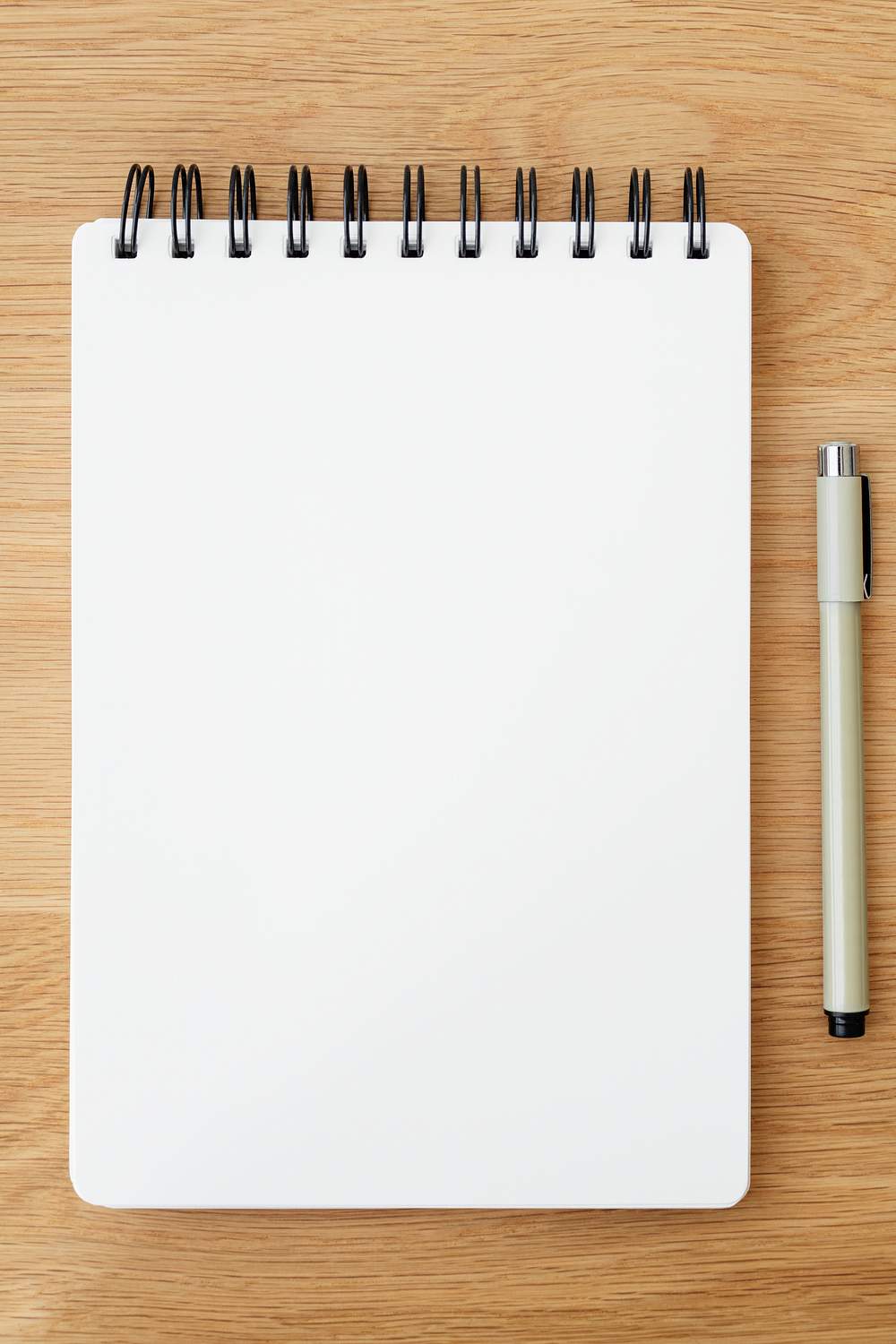 Blank plain white notebook page with a pen Free stock photo High
