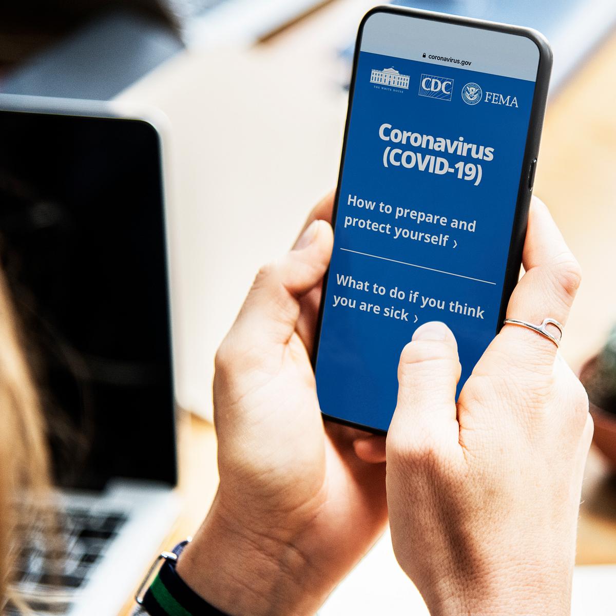 Woman reading coronavirus information from a… | Free stock photo | High Resolution image Woman reading coronavirus information from a phone mockup with editorial graphic from https://www.coronavirus.gov/ accessed…