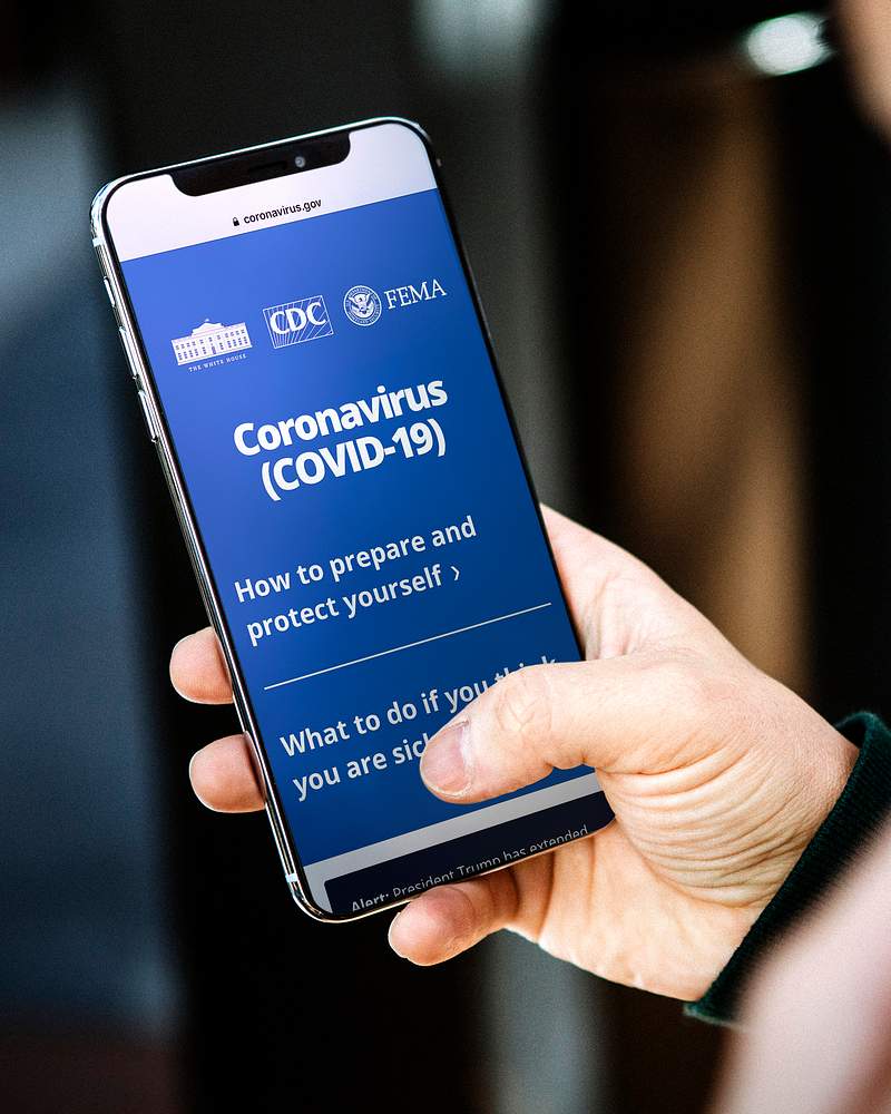 Woman reading coronavirus information from a… | Free stock photo | High Resolution image Woman reading coronavirus information from a phone mockup with editorial graphic from https://www.coronavirus.gov/ accessed…
