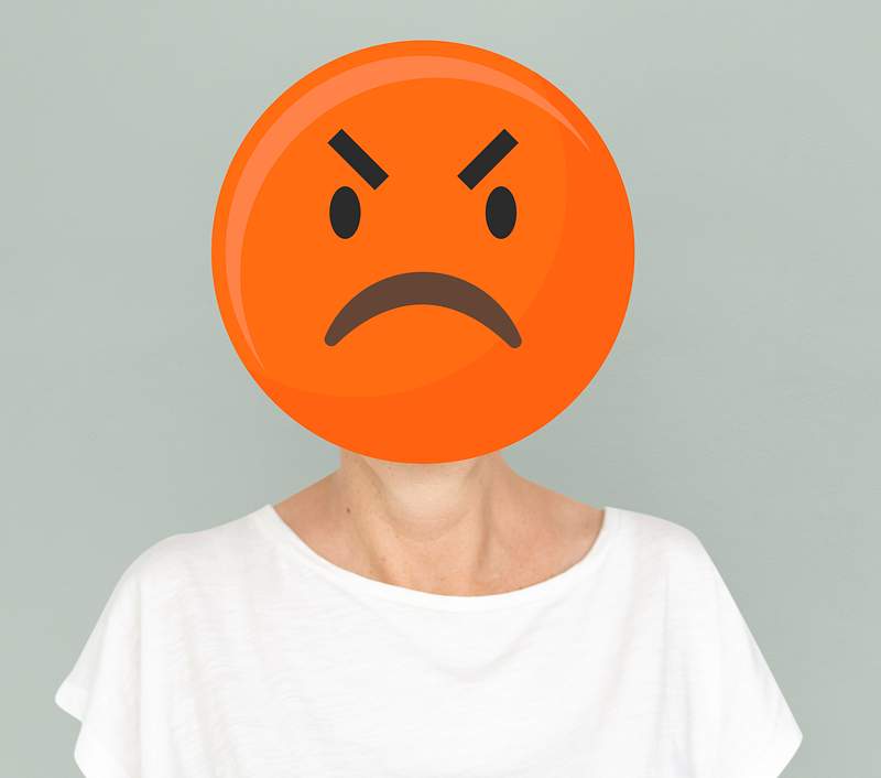 Angry emoji faced woman