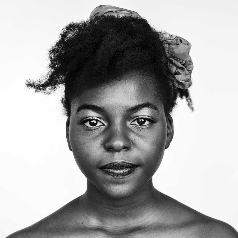 Portrait of an African woman Portrait of an African woman - adult, african, alone, black and white, closeup, expression, face, faces, focus, isolated…