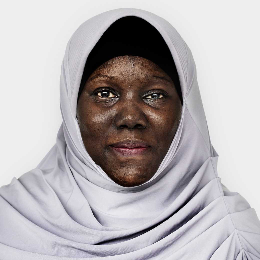 Portrait of an Ugandan woman Portrait of an Ugandan woman - adult, african, african descent, alone, black, cheerful, east africa, emotion, expression…