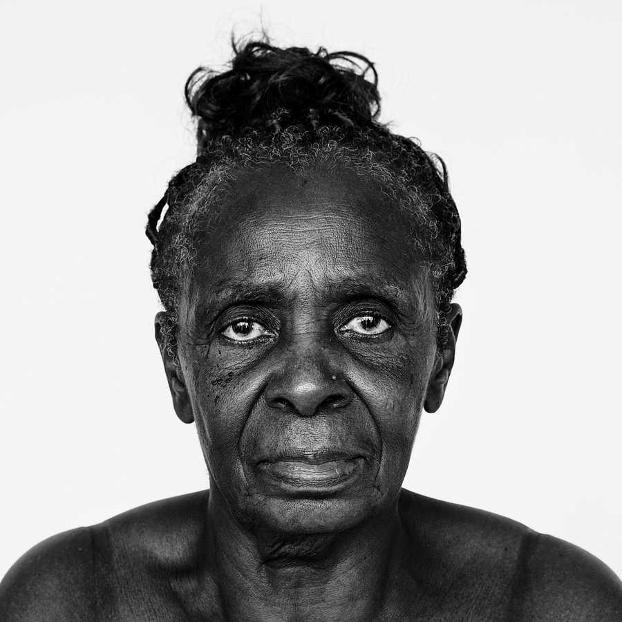 Portrait of a Congolese woman Portrait of a Congolese woman - adult, african, african descent, alone, black, black and white, central africa, cheerful…