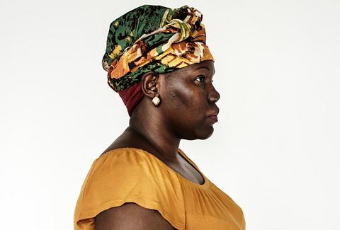 Portrait of an Ugandan woman Portrait of an Ugandan woman - adult, african, african descent, alone, black, blouse, cheerful, east africa, emotion…
