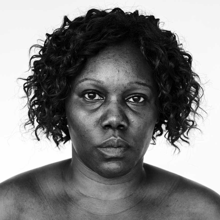 Portrait of an Ugandan woman Portrait of an Ugandan woman - adult, african, african descent, alone, bared chest, black, black and white, cheerful, east…
