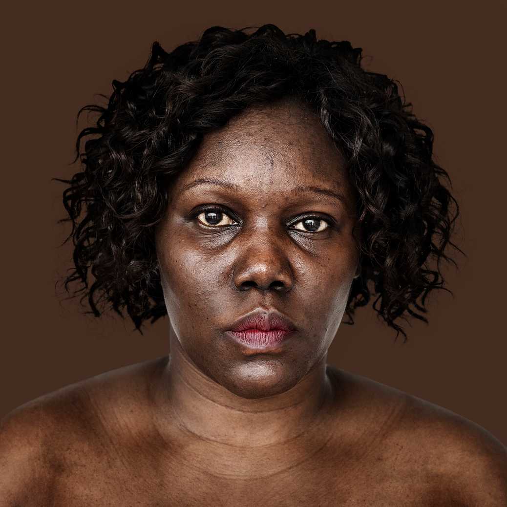 Portrait of an Ugandan woman Portrait of an Ugandan woman - adult, african, african descent, alone, bared chest, black, cheerful, east africa, emotion…