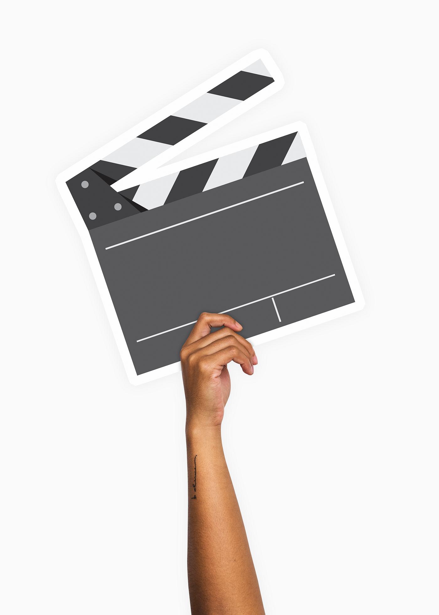 Hand holding a clapperboard prop Hand holding a clapperboard prop