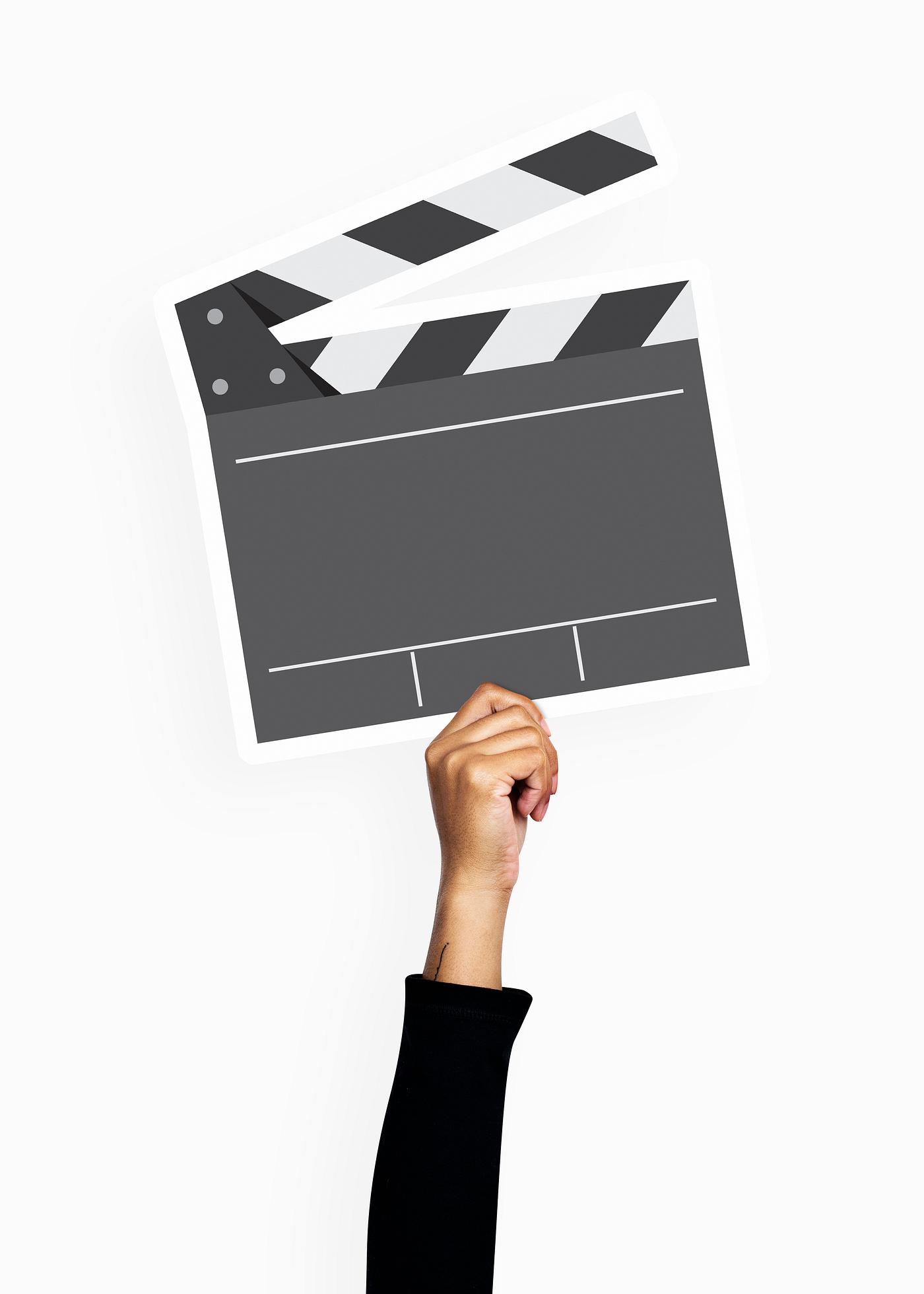 Hand holding a clapperboard prop Hand holding a clapperboard prop