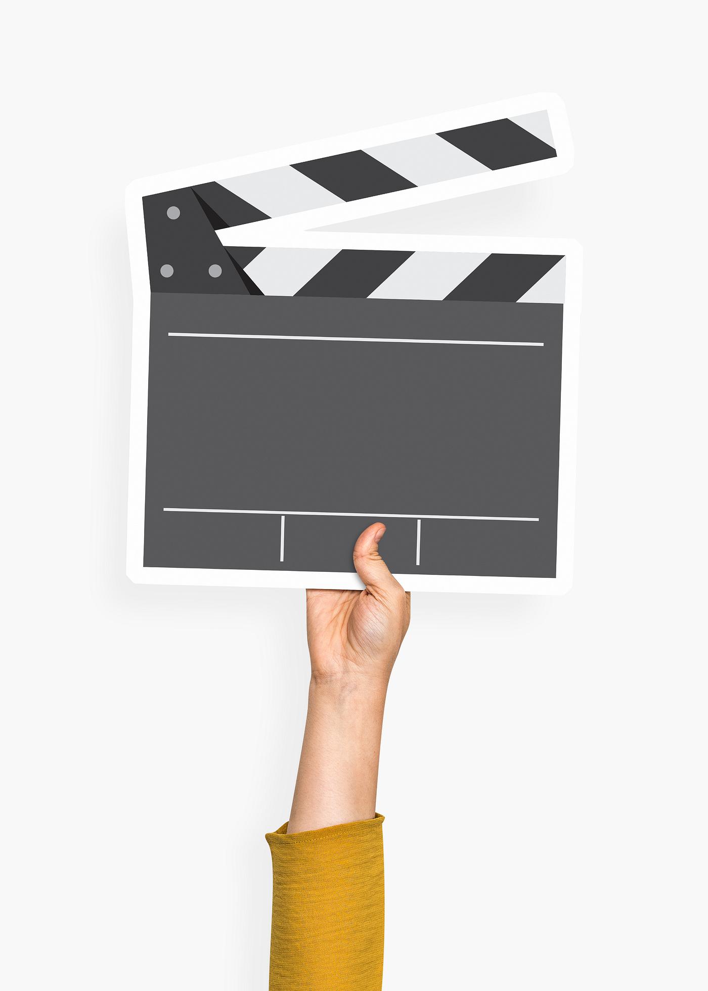 Hand holding a clapperboard prop Hand holding a clapperboard prop