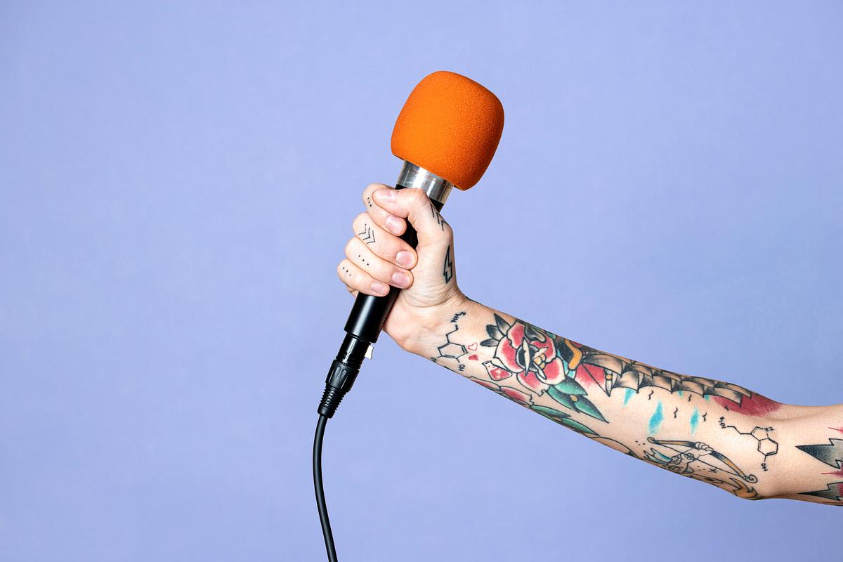 Download Microphone In A Tattooed Hand Royalty Free Stock Photo High Resolution Image