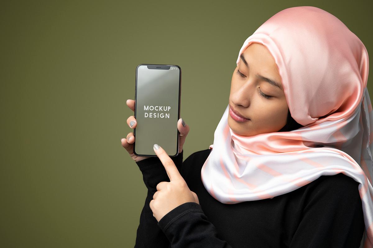 Woman Wearing Hijab Holding A Mobile Phone Mockup Royalty Free Stock Photo High Resolution Image