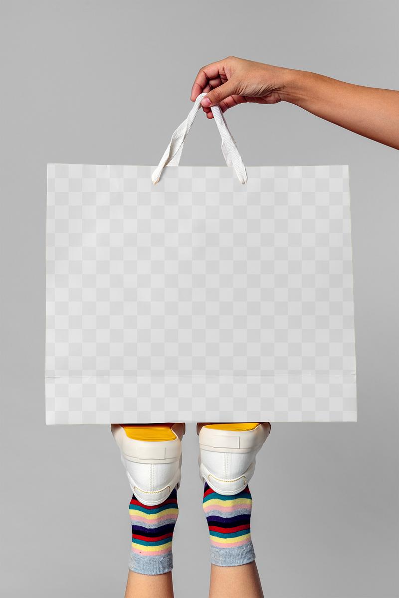 Download Woman carrying a minimal paper bag | Royalty free psd mockup - 1198588