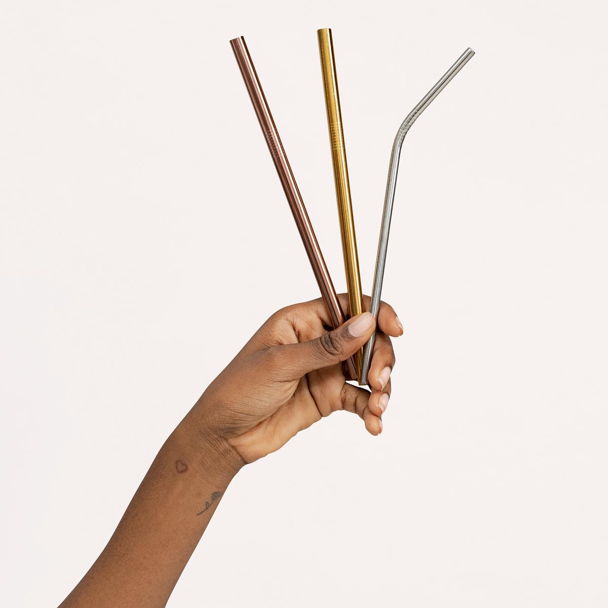 Download Hand holding metal straws mockup