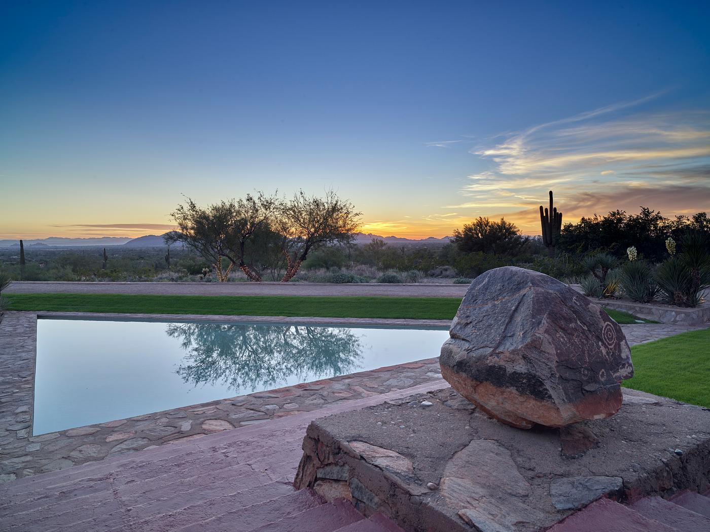 Petroglyph and pool at Taliesin West, renowned architect Frank Lloyd Wright's winter home and school in the desert... Petroglyph and pool at Taliesin West, renowned architect Frank Lloyd Wright's winter home and school in the desert...