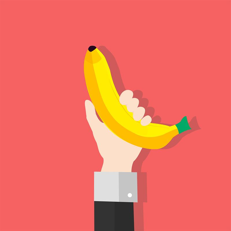 Illustration of a hand holding a banana. 